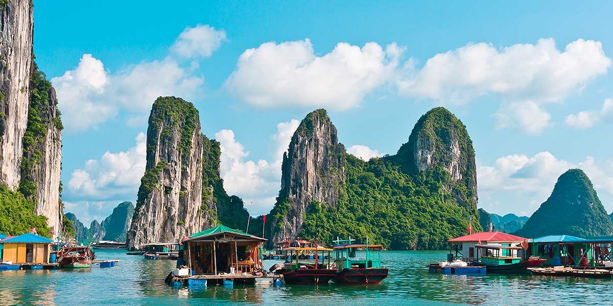 Limestone karsts and floating village in Ha Long Bay